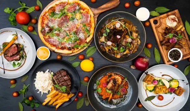 Spread of restaurant dishes on a table